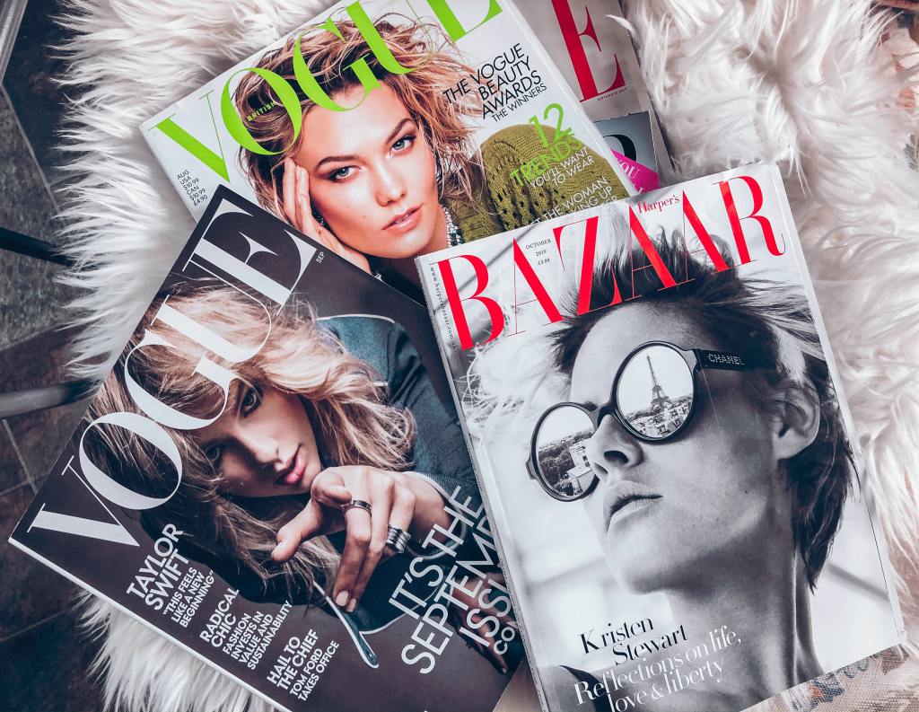 Vogue, Bazaar magazine on a white carpet